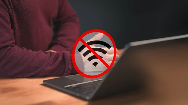 Technology concept of wifi connected but no internet. Man using a laptop computer to connect to wifi but wifi not connected or password is incorrect and waiting to loading digital data form website.