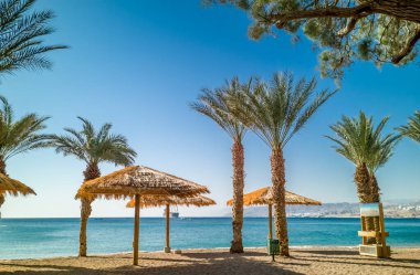 Morning on sandy beach in Eilat - famous tourist resort and recreation city in Israel