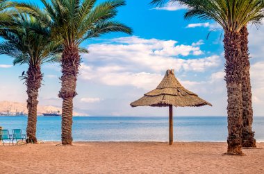 Morning on sandy beach in Eilat - famous tourist resort and recreation city in Israel