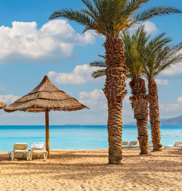Public beach in Eilat - famous tourist resort and recreational city located on the Red Sea, Israel