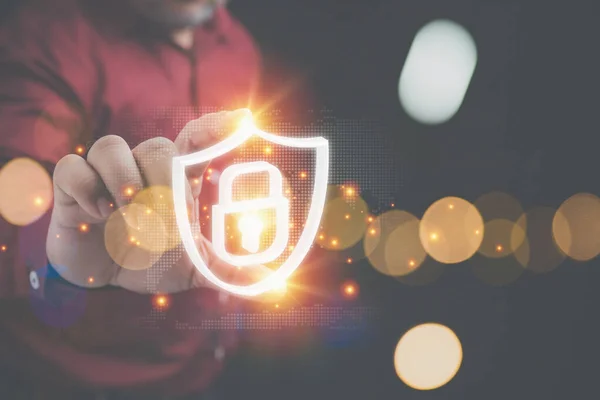 Cyber security concept. Internet privacy data protection. Businessman holding shield with padlock for protecting business and financial data to protect personal.