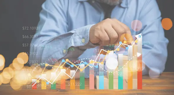 Businessman planning goal, set strategy marketing and investment to stock market with growing diagram virtual screen, and colourful graph. Growth of graph statistic increase.
