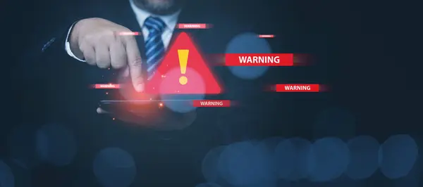 System warming alerts on a tablet, firewall for notification error and maintenance. Connection and information danger. Businessman view at a tablets to check alert emergency or warning.