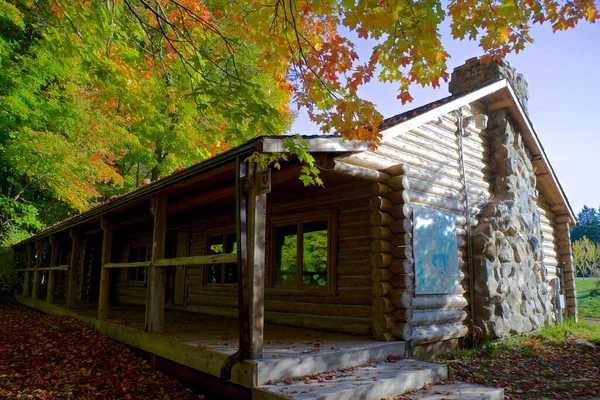 Traditional wooden log house built from wood logs on autumn, King City, Ontario, Canada.