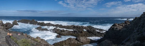 stock image Huge panorama photo of gay couple on natural ocean and rock pools in tenerife, canarias, spain