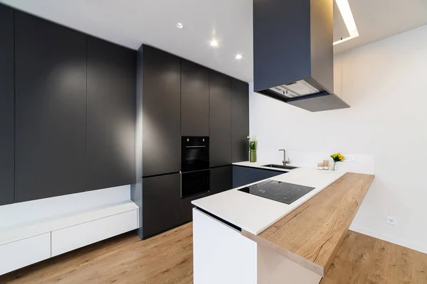 stock image New black kitchen studio in loft style