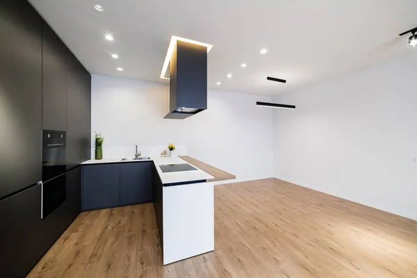Cloth interior design of a house with a black kitchen