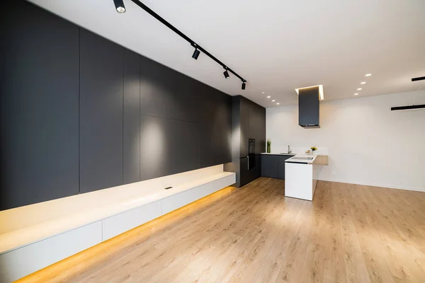 Black furniture, stylish kitchen in loft style