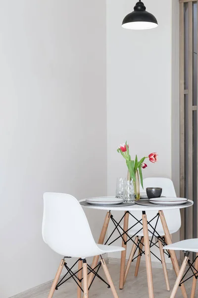 stock image new white table and chairs for dining in the kitchen in a new house