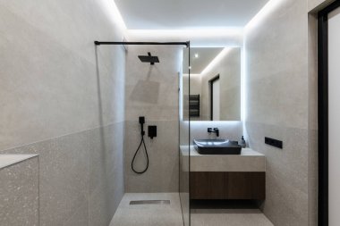 stylish and modern bathroom interior design with tiles and lighting