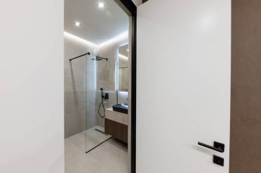 stylish and modern bathroom interior design with tiles and lighting