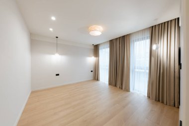 clean large bright room with white walls and lighting