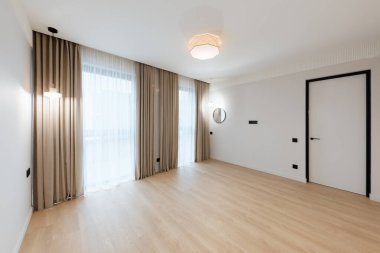 clean large bright room with white walls and lighting