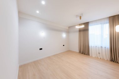 clean large bright room with white walls and lighting