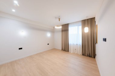 clean large bright room with white walls and lighting