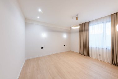 clean large bright room with white walls and lighting