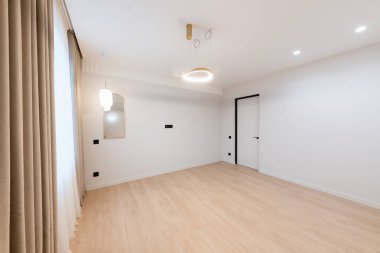 clean large bright room with white walls and lighting