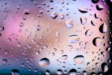Water drops on glass, raindrops, texture, banner and background, colored drops