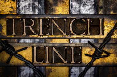 Trench Line text with barbed wire in real authentic typeset letters on vintage textured silver grunge copper and gold background clipart