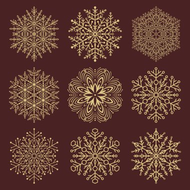 Bir dizi vektör kar taneleri. Kış süsü koleksiyonu. Kar taneleri kahverengi ve altın koleksiyonu. Arkaplan ve tasarımlar için kar taneleri