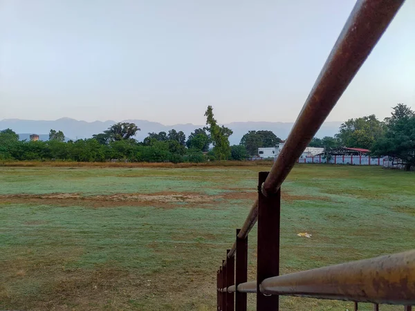A wide angle shot of an empty playground taken from stands during corona pandemic. Dehradun City Uttarakhand India