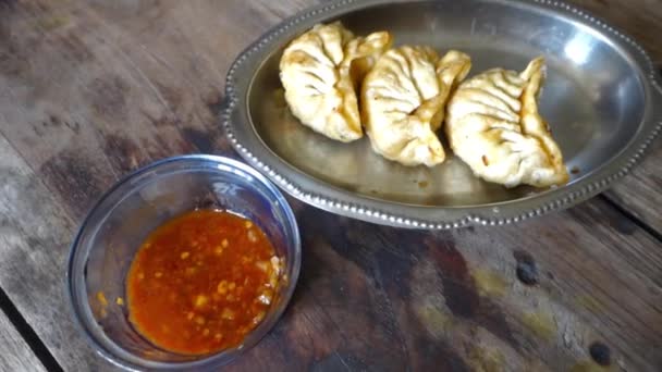 Fried Momos Dumplings Served Red Hot Chutney Cinematic Wooden Table — Stock Video