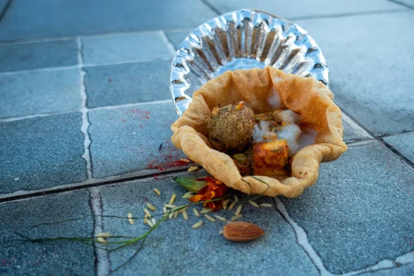 Food placed on a paper plate during a Hindu Ritual in the month of Sharada. Indian Customs and Traditional.