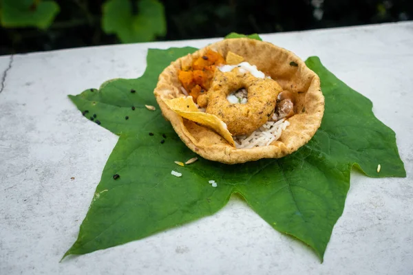 Food placed on a green leaf during a Hindu Ritual in the month of Sharada. Indian Customs and Traditional.