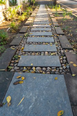 A well maintained pavement made of stone tiles and pebbles. Uttarakhand India. clipart