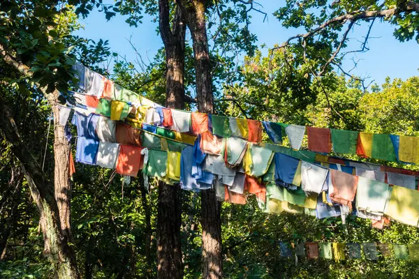 stock image Date: Oct. 14th, 2022. Dehradun, Uttarakhand, India. Tibetan prayer flags adorn Himalayan trails & peaks. Colorful, rectangular cloth blessings.