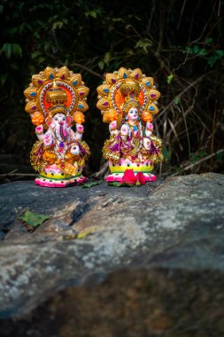 May 1st 2024, Dehradun Uttarakhand India. Indian deities Lord Ganesha and Goddess Lakshmi sculptures placed on stone top. clipart
