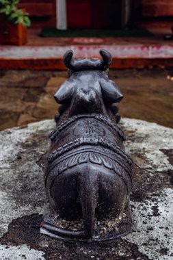 Aug2nd2024, Uttarakhand India. Nandi bull statue on the premises of Bineshwar Mahadev Temple, dedicated to Lord Shiva, an ancient Hindu site in Binsar District, Almora, Uttarakhand. clipart