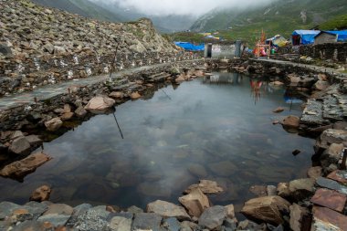 July25th2024, Himachal Pradesh, India. Gauri Kund, a sacred pond dedicated to Hindu goddess Gauri Mata, where devotees offer prayers during the Mani Mahesh Kailash Yatra in Chamba Valley, clipart