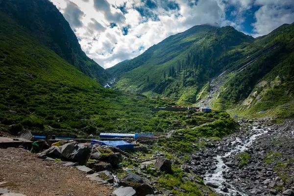 stock image Explore Chamba Valley's stunning glacial rivers and towering Himalayan peaks, including the sacred Mani Mahesh Kailash pilgrimage of Lord Shiva. Himachal Pradesh India.