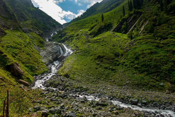 stock image Explore Chamba Valley's stunning glacial rivers and towering Himalayan peaks, including the sacred Mani Mahesh Kailash pilgrimage of Lord Shiva. Himachal Pradesh India.