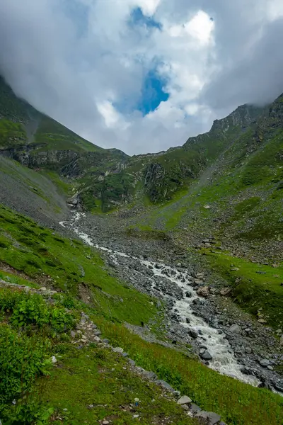 stock image Explore Chamba Valley's stunning glacial rivers and towering Himalayan peaks, including the sacred Mani Mahesh Kailash pilgrimage of Lord Shiva. Himachal Pradesh India.