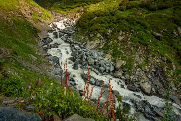 stock image Explore Chamba Valley's stunning glacial rivers and towering Himalayan peaks, including the sacred Mani Mahesh Kailash pilgrimage of Lord Shiva. Himachal Pradesh India.