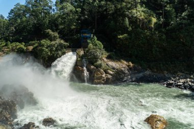 Nov.3rd2024. Uttarakhand India. Water escaping forcefully from the tunnel of Maneri Dam, a concrete gravity dam on the Bhagirathi River in Uttarkashi, Uttarakhand, clipart