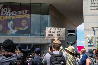 Philadelphia, PA USA - 06-25-2002 Crowd at pro-choice Josh Shapiro rally, man holds sign that reads Republican Sentaors Did This. Crowd of men and women with protest signs, photographers in sunny