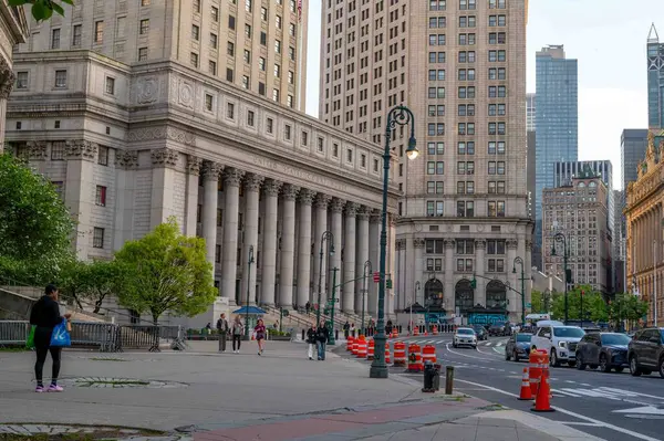 stock image New York, NY, USA 05-13-2024 Federal Courthouse exterior in Manhattan NYC with traffic cones, pedestrians, traffic lights, urban street scene in daylight.