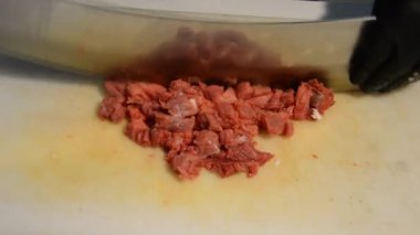 preparing kebab with big knife