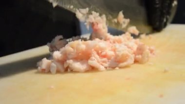 preparing kebab with big knife