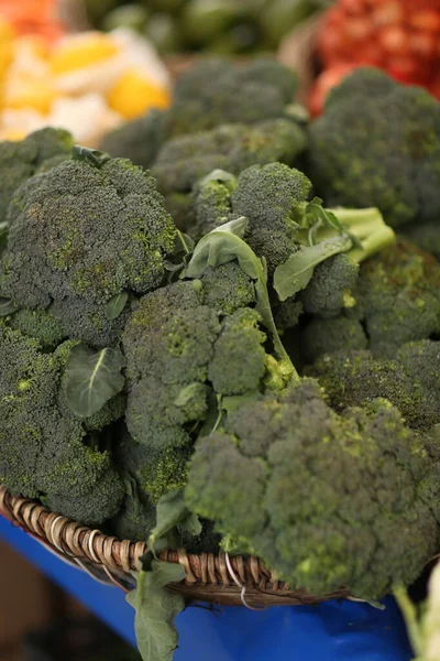 broccoli waiting to be sold on the market shelf