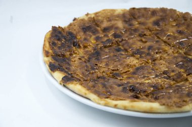 sweet pita bread served with hazelnuts, pistachios and honey baked in the oven