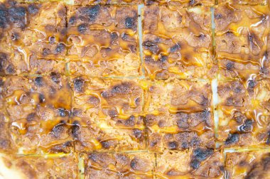 sweet pita bread served with hazelnuts, pistachios and honey baked in the oven