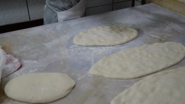 Male Baker Makes Turkish Pizza