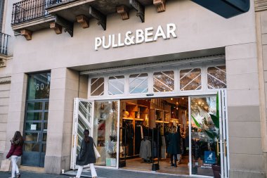 Barcelona, Spain, 20 December 2022: Pull and Bear shop entrance at city center. High quality photo