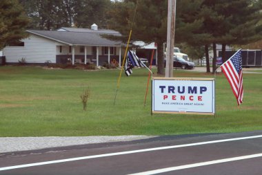 Lancaster, Ohio October 5, 2020 Trump Pence Campaign sign in rural Fairfield County. clipart