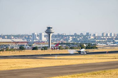 Boeing 737-8AS B738 white, blue and yellow Ryanair airline with registration EI-EBA, Irish flag and the landing gear lowered for landing at Barajas.