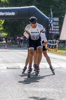 3 July 2022. Aranjuez, Spain. Vertical image of the marathon skating league held in the streets of Aranjuez by the river.